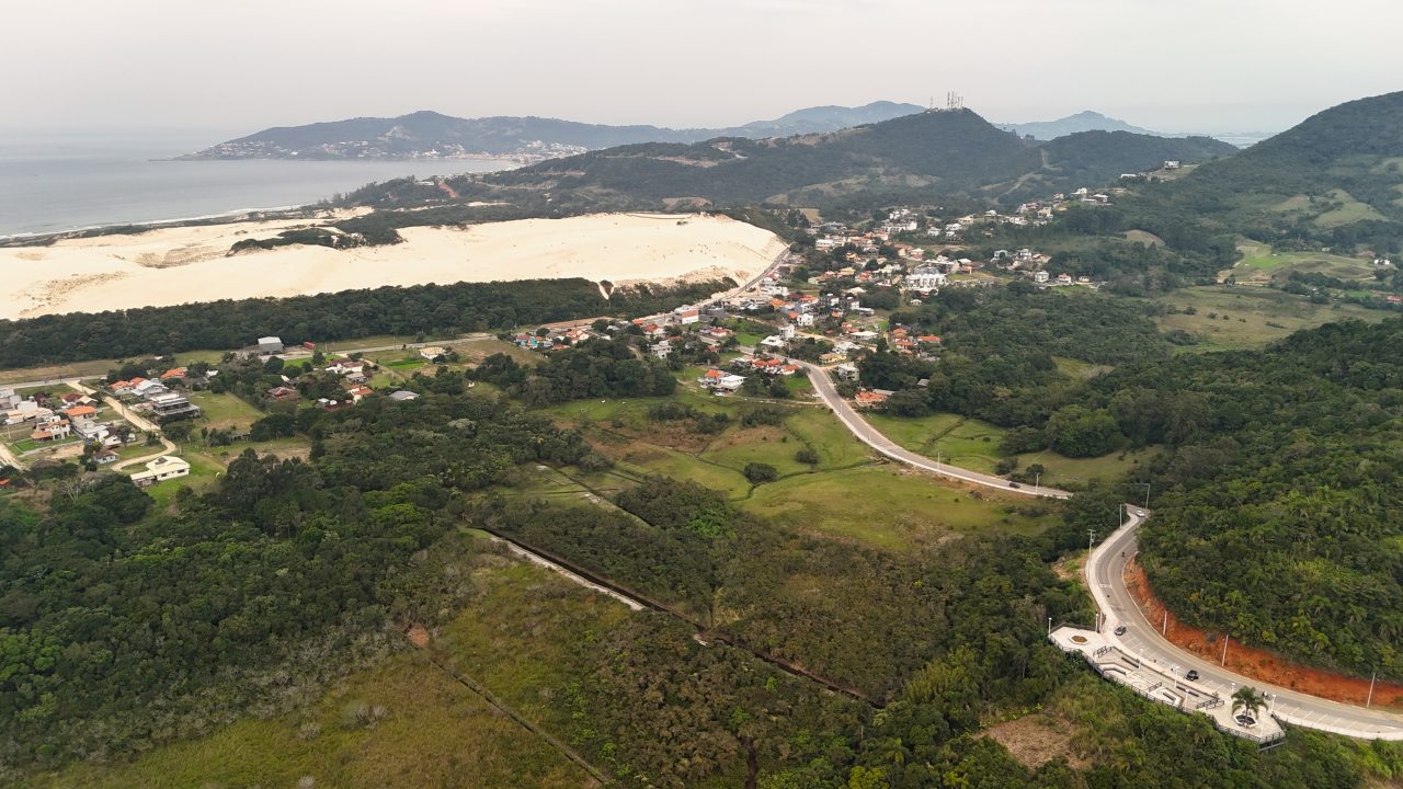 a aerial view of a town and a beach